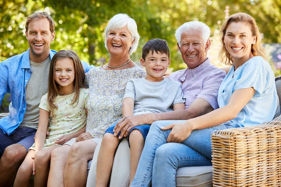 Three generation family sitting together in the garden glaucoma